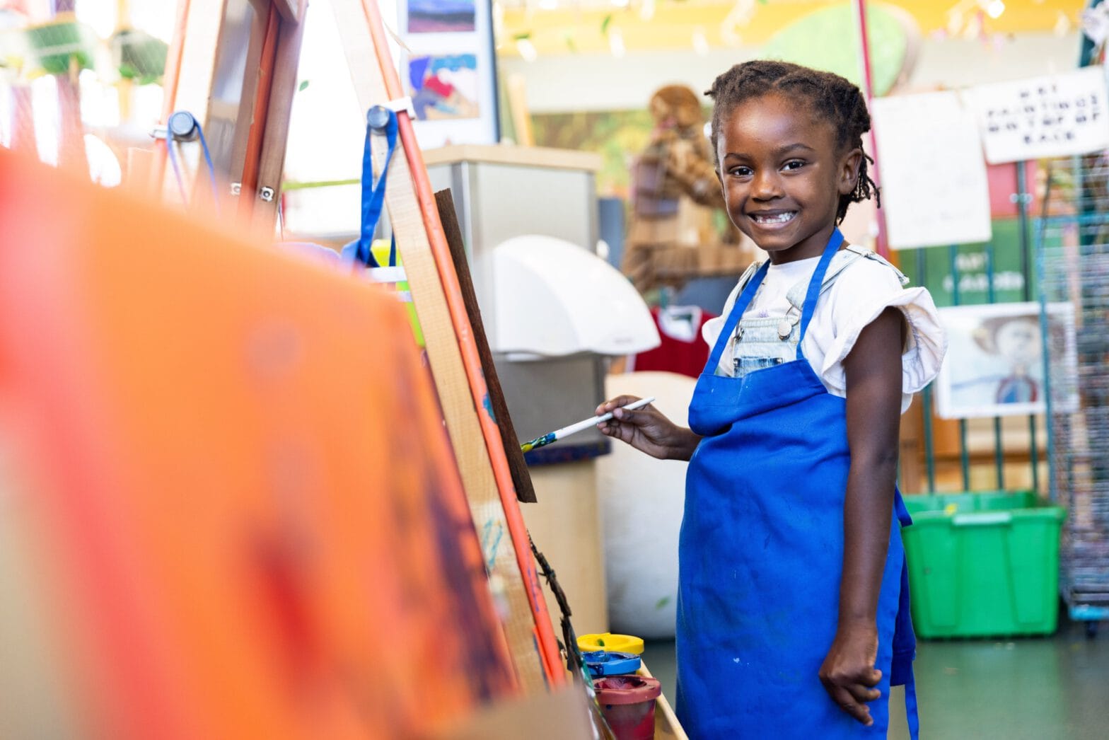 Image of a girl painting in the Knock Knock Children's Museum