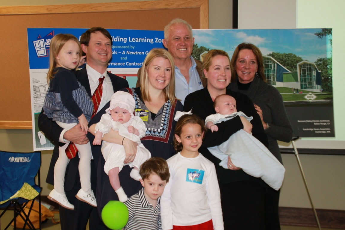 Thomas family posing for a photo at the opening of the By-You Building Learning Zone