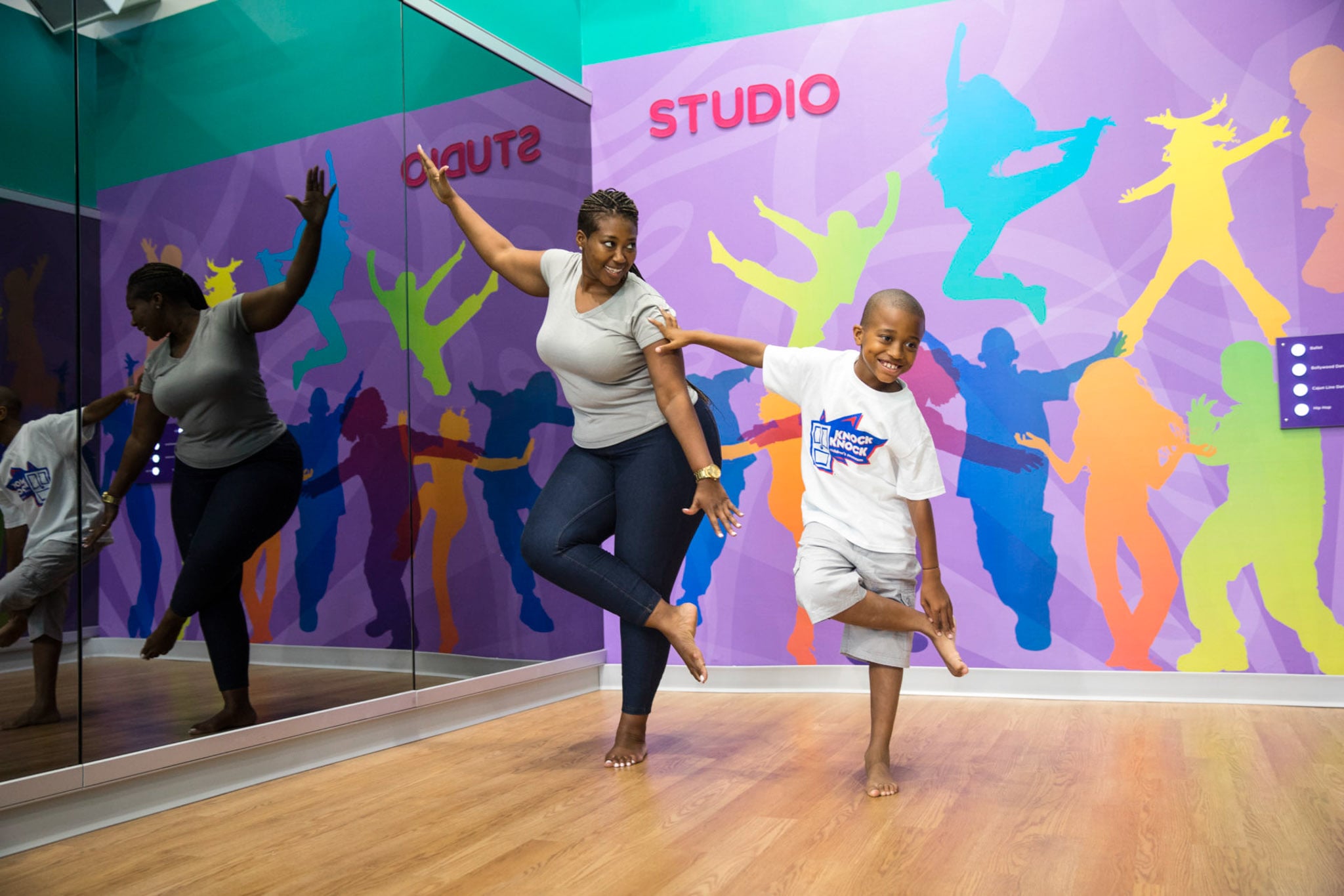 A mom and son practicing dance moves in the BR Star Studio.