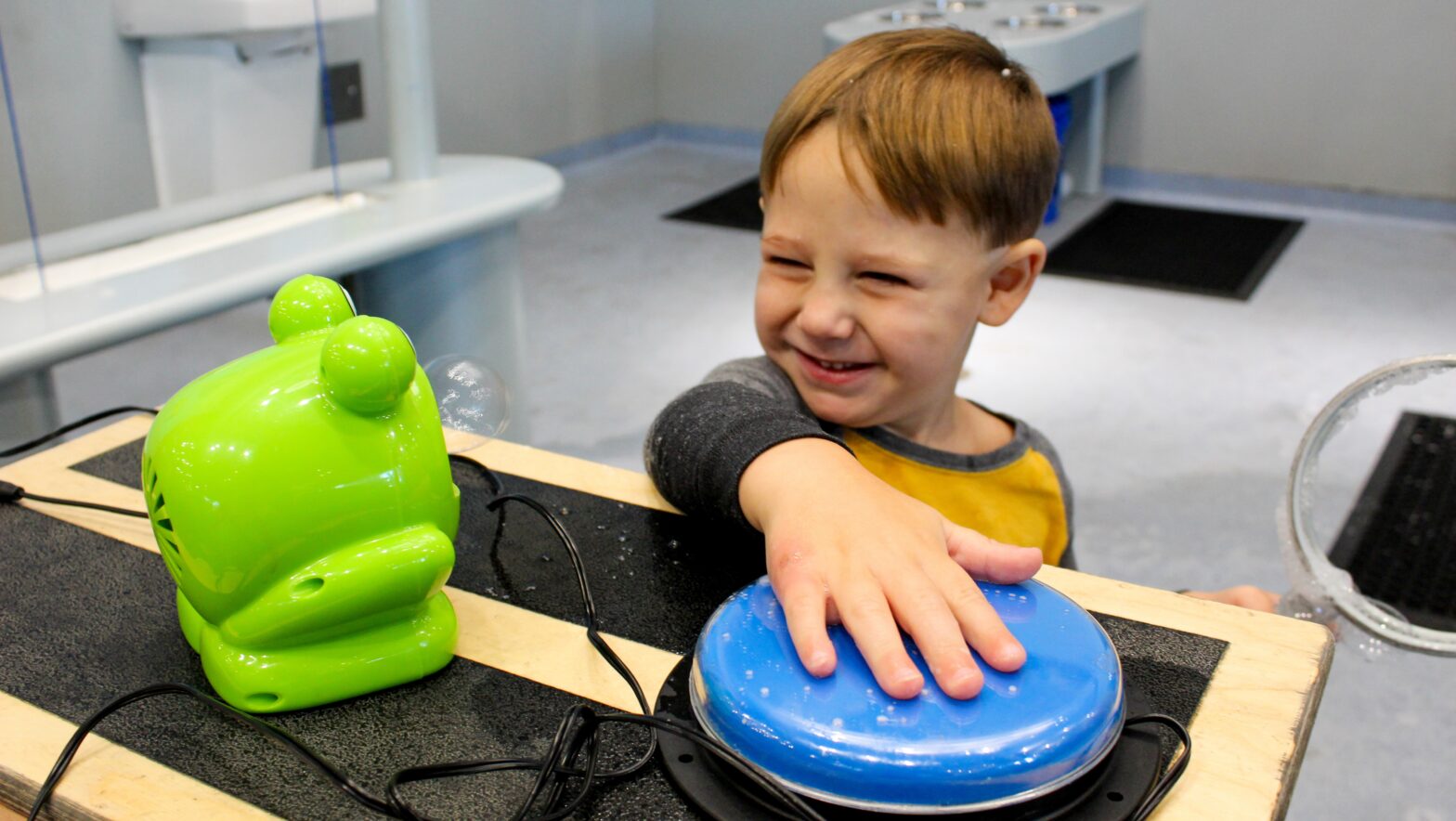 Boy playing with a bubble machine