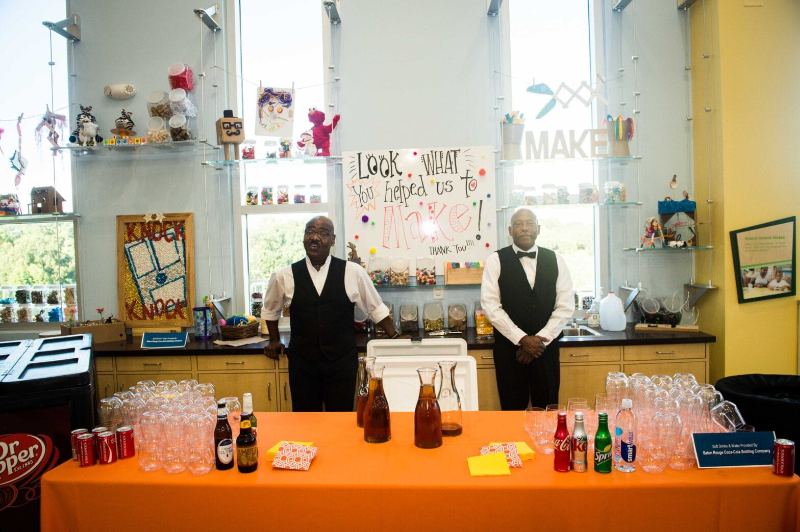 Two bartenders and a bar for an event at the Knock Knock Museum
