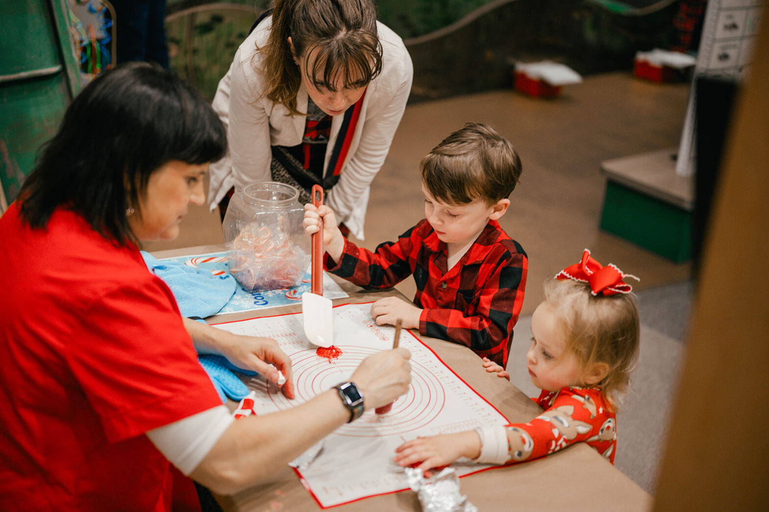 children paint a Christmas painting
