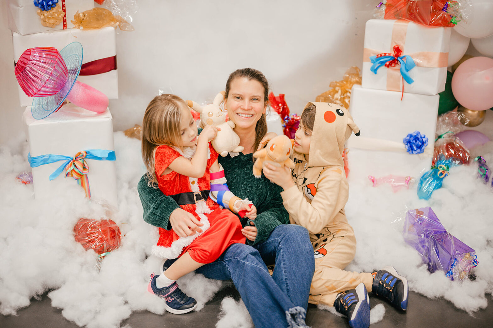 a family poses for a photo in their Christmas attire
