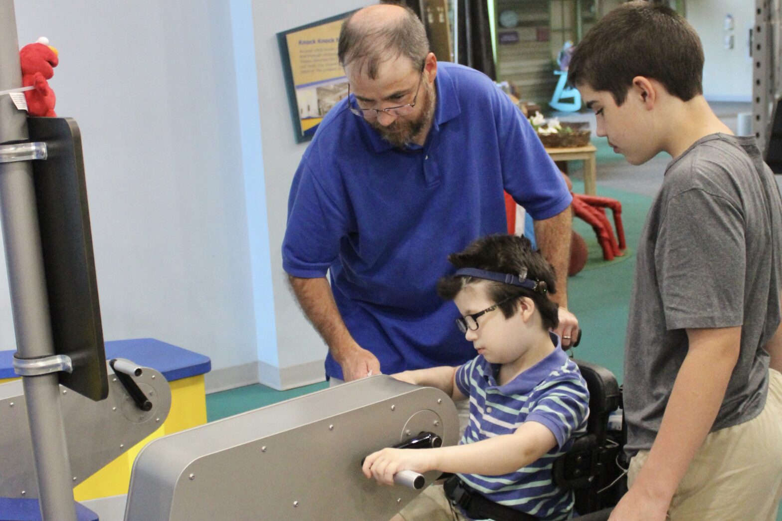 a boy pushes the pedals at Knock Knock's Ship Shape Health Challenge.
