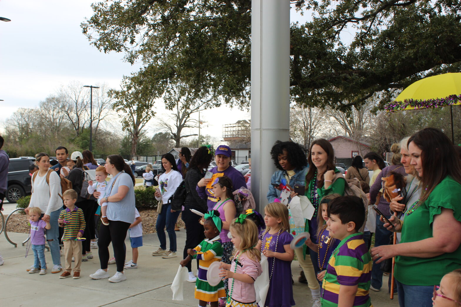 Groups of families dancing in second line parade.